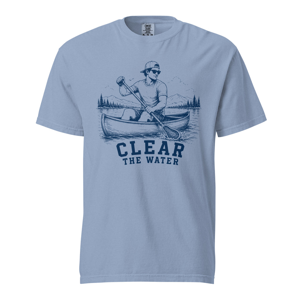 Lacrosse shirt with the GO2X Clear the Water design, a man paddling a canoe with a lacrosse-head paddle on a mountain lake
