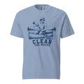 Lacrosse shirt with the GO2X Clear the Water design, a man paddling a canoe with a lacrosse-head paddle on a mountain lake