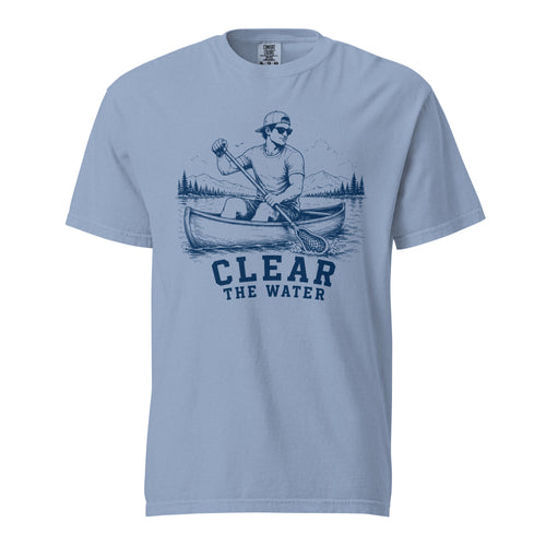 Lacrosse shirt with the GO2X Clear the Water design, a man paddling a canoe with a lacrosse-head paddle on a mountain lake