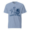 Lacrosse shirt with the GO2X Feeding the Crease design, a man sliding a pizza into a wood-fired oven with a lacrosse stick