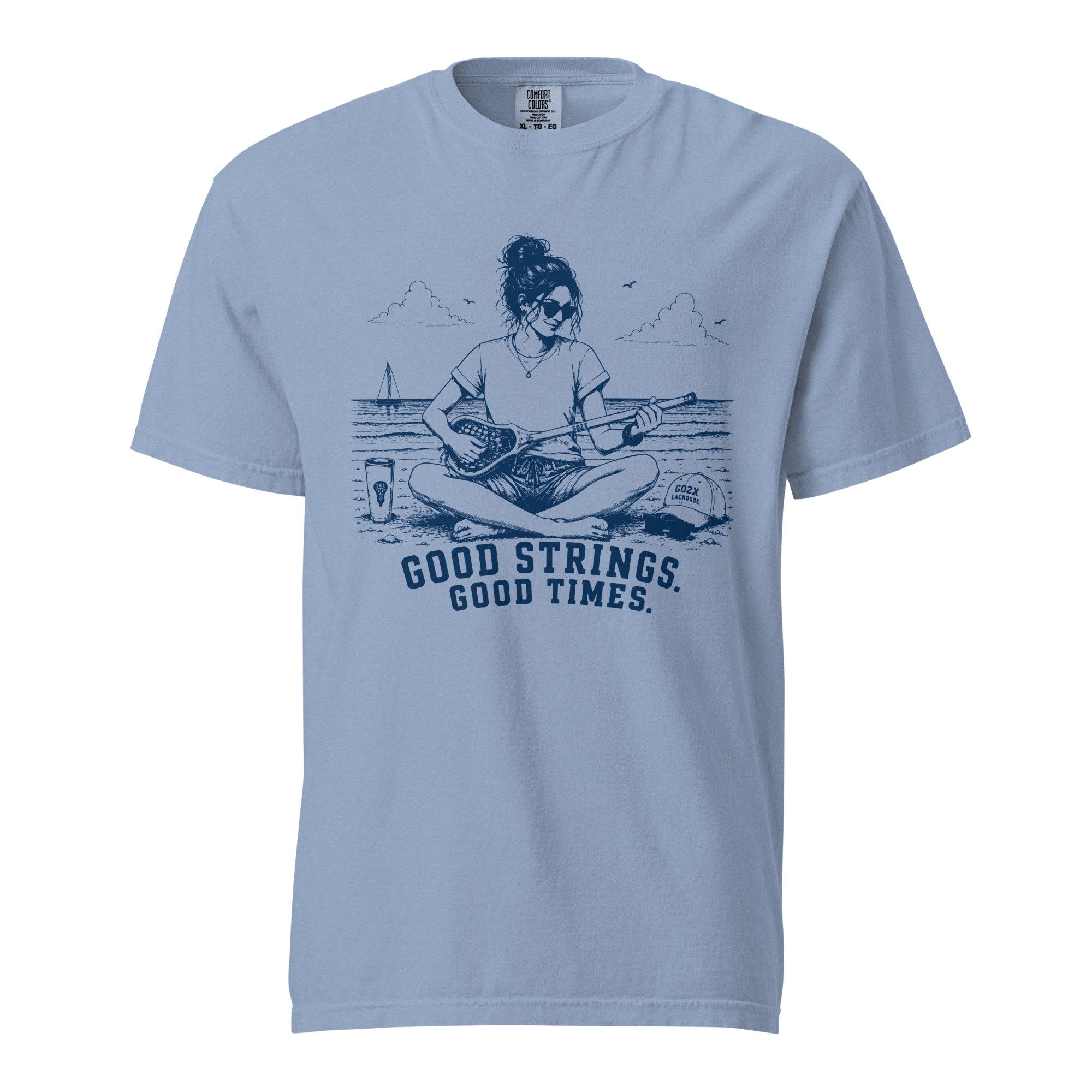 Lacrosse shirt with the GO2X Good Strings Good Times design, a woman on the beach playing a lacrosse stick like a guitar