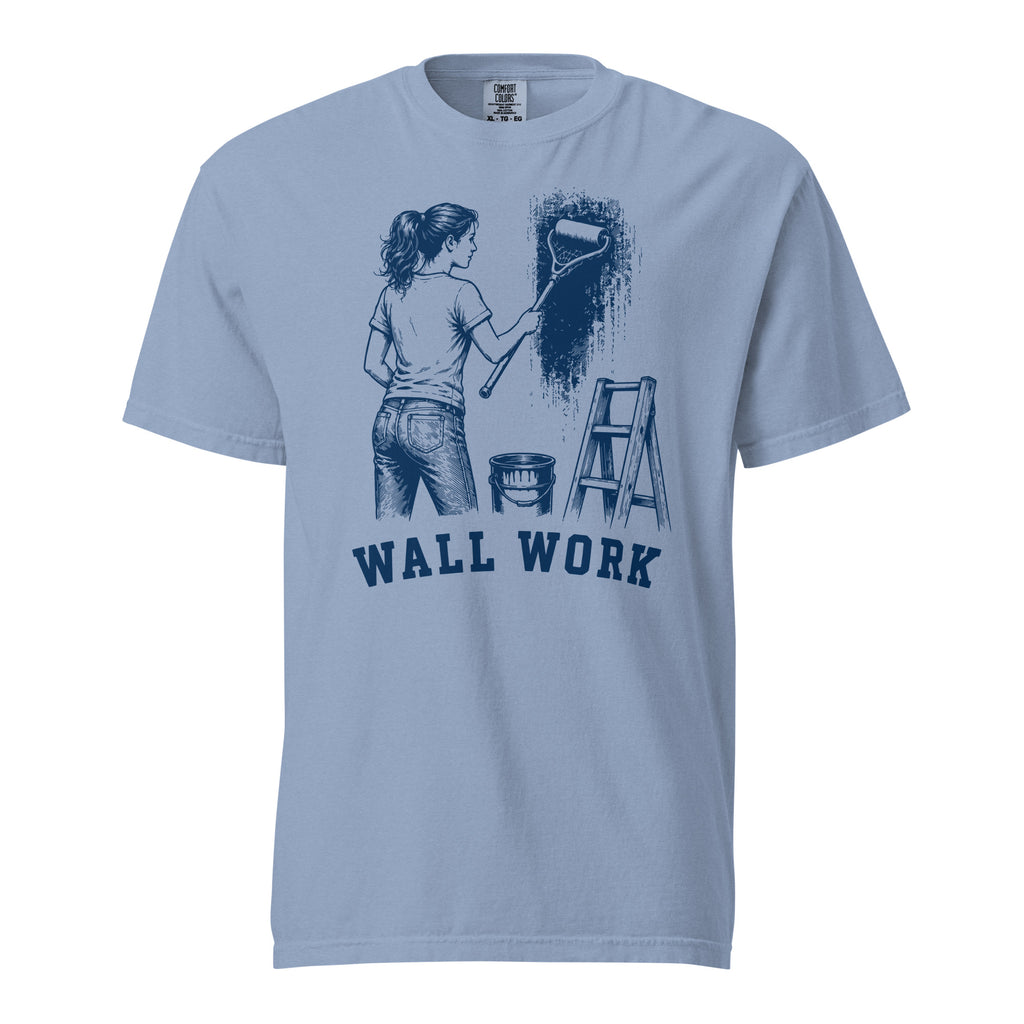 Lacrosse shirt with the GO2X Wall Work design, a woman painting a wall with a lacrosse-head paint roller