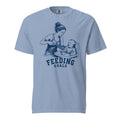 Lacrosse shirt with the GO2X Feeding Goals design, a woman feeding a baby in a high chair with a lacrosse stick