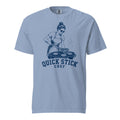 Lacrosse shirt with the GO2X Quick Stick Chef design, a woman flipping burgers on a grill with a lacrosse head