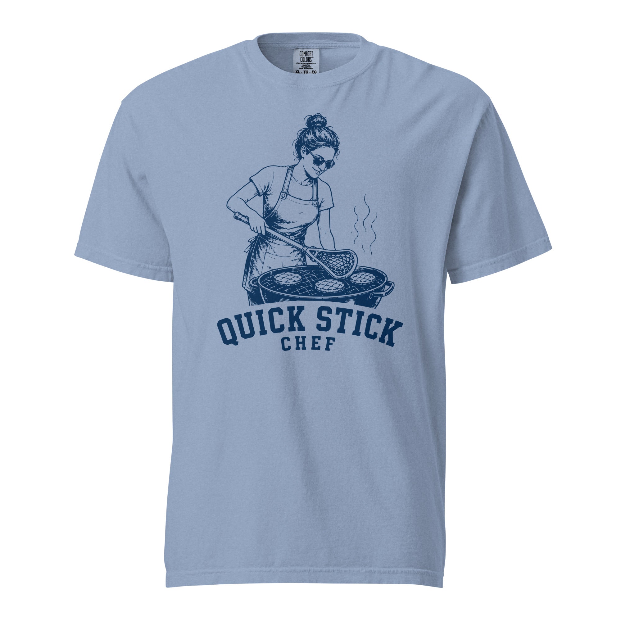 Lacrosse shirt with the GO2X Quick Stick Chef design, a woman flipping burgers on a grill with a lacrosse head