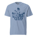 Lacrosse shirt with the GO2X Clear the Water design, a woman paddling a canoe with a lacrosse-head paddle on a mountain lake