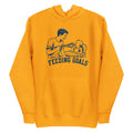 Lacrosse hoodie with the GO2X Feeding Goals design, a man feeding a baby in a high chair with a lacrosse stick