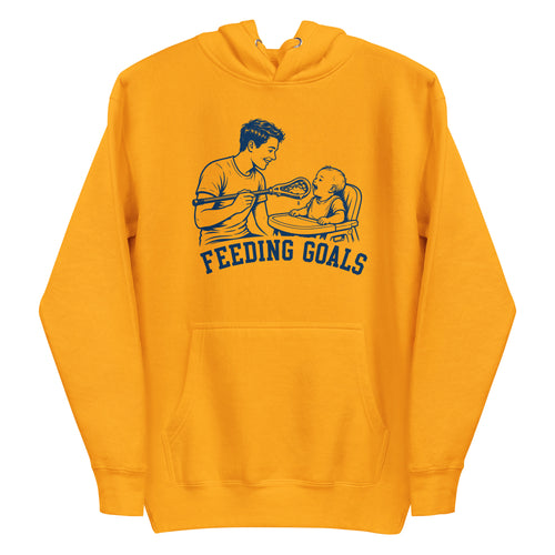 Lacrosse hoodie with the GO2X Feeding Goals design, a man feeding a baby in a high chair with a lacrosse stick